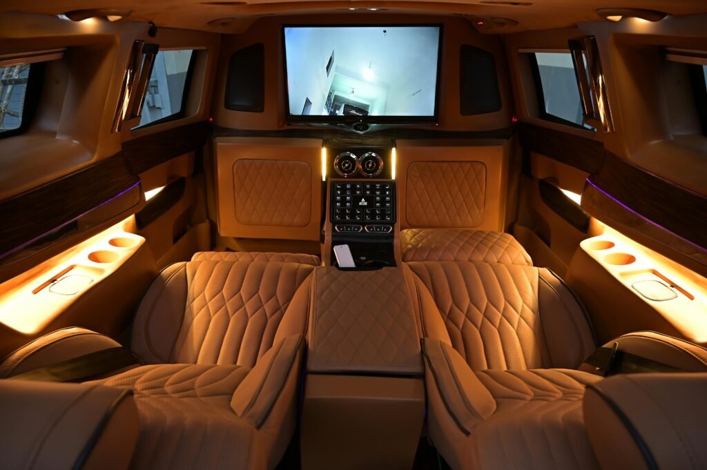 Elegant limousine interior featuring plush leather seats and ambient lighting for ultimate comfort.